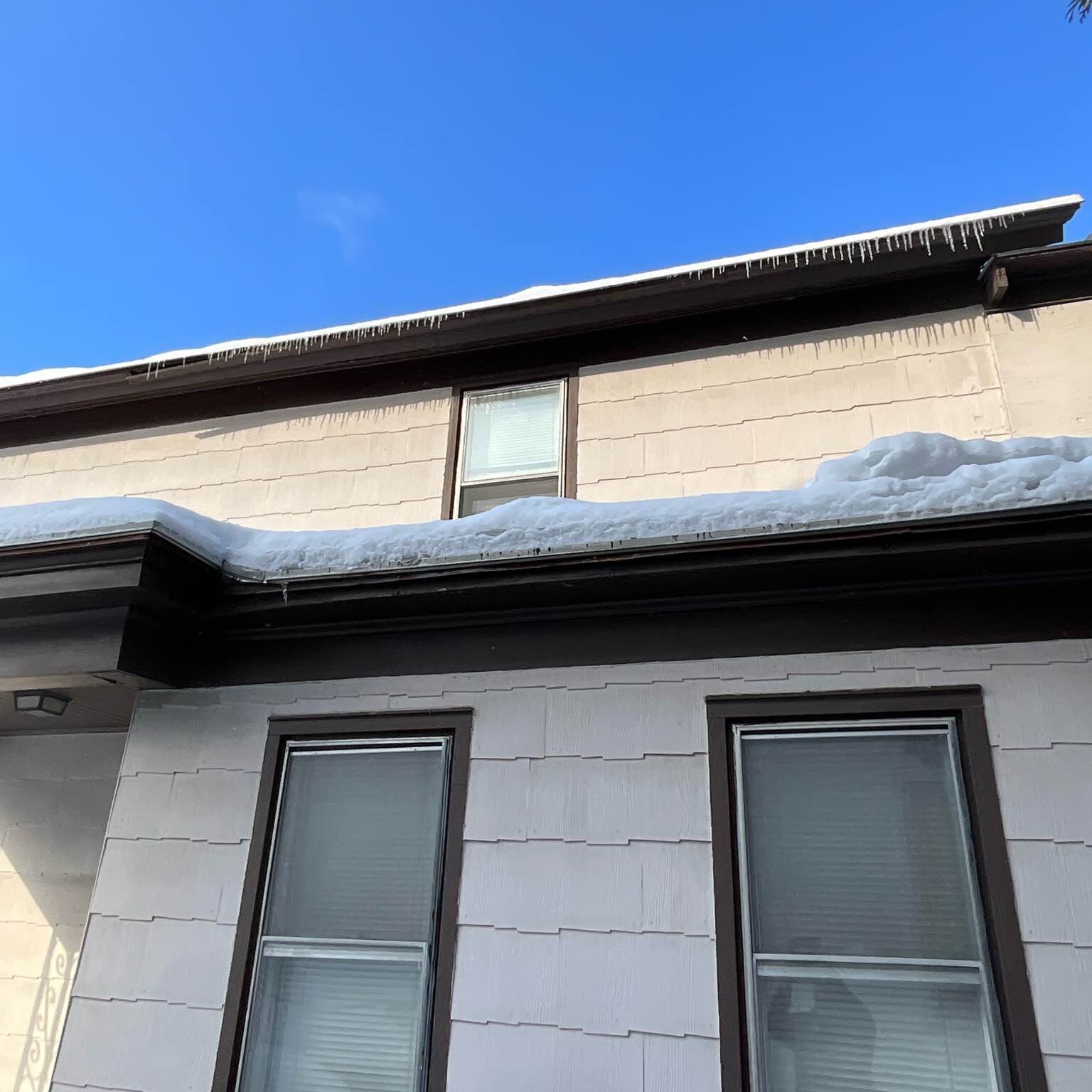 Before: old double hung windows, showing age with peeling paint and foggy glass.