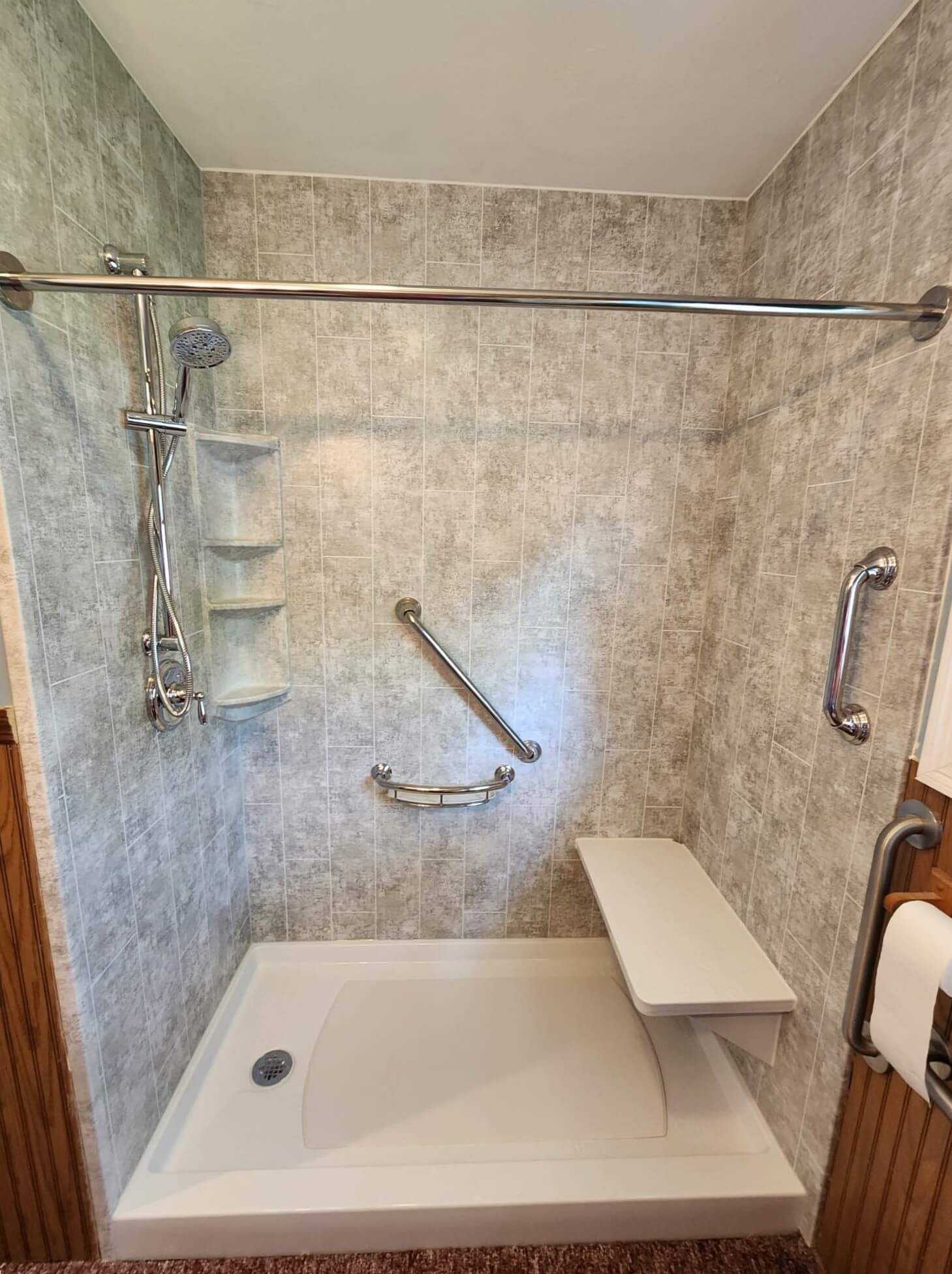 Walk in shower completed by New York Sash walk-in-shower-chrome-fixtures-bench-seat