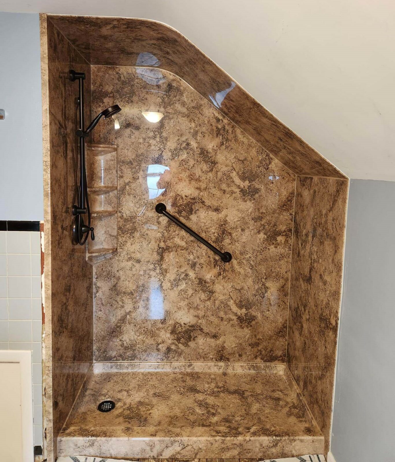 New Walk-in Shower in Madeira Granite with Bronze Fixtures