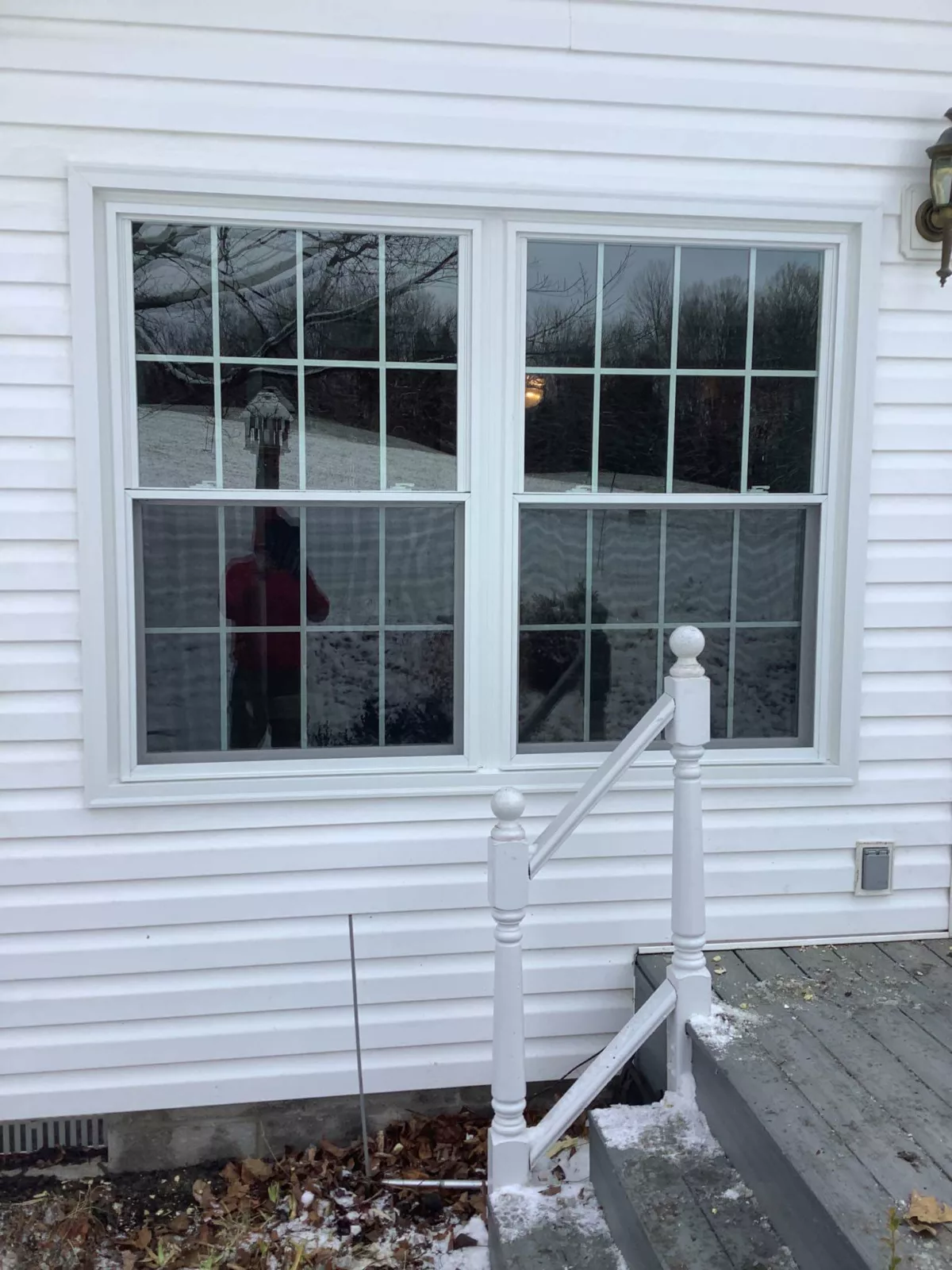 Mulled double hung windows finished in white.