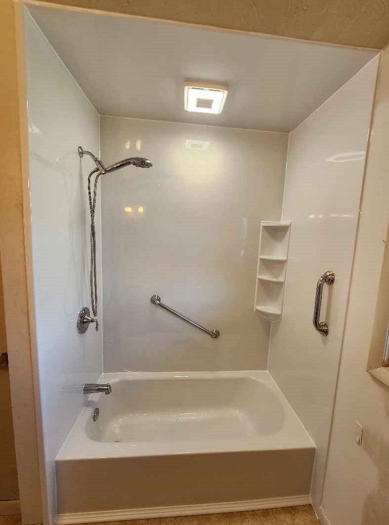 White Tub & Shower with Chrome fixtures
