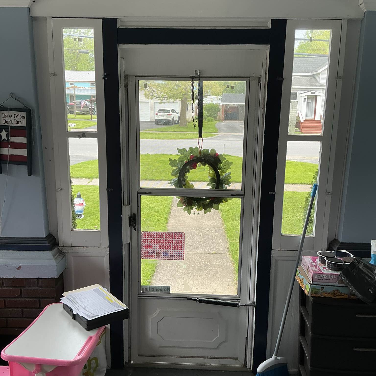 Awaiting newly installed replacement windows and door by New York Sash, brightening the living area and providing great views.