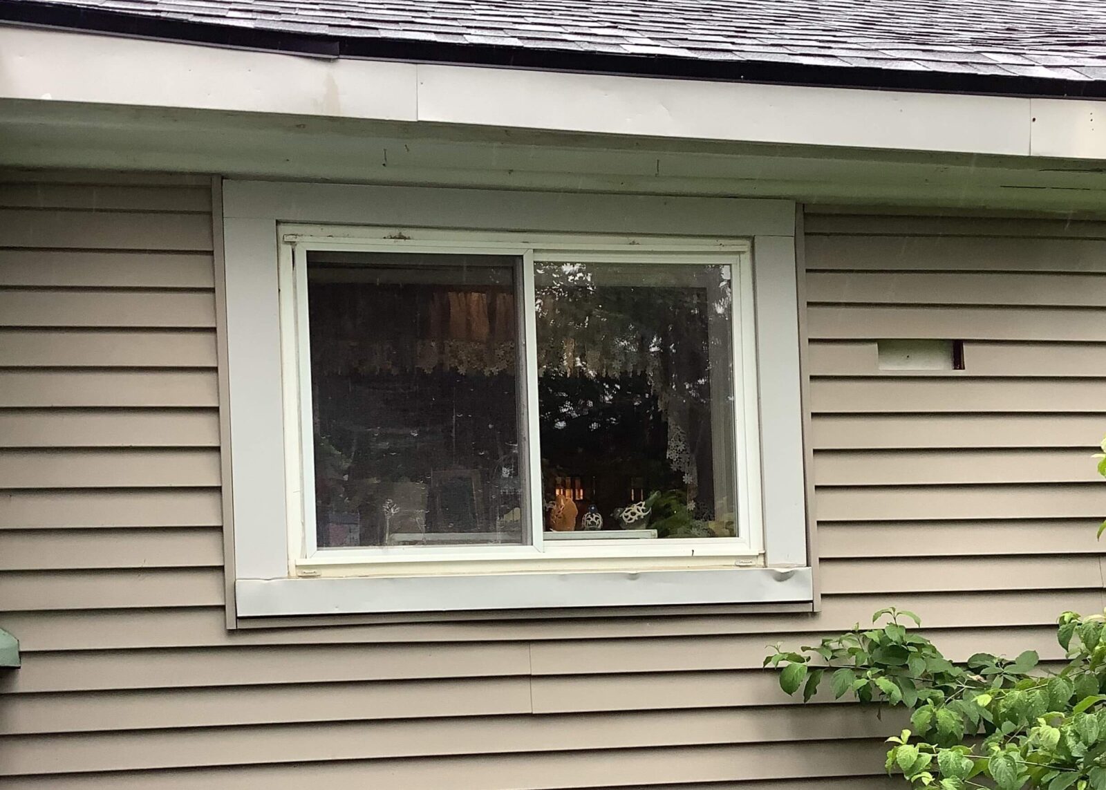 Exterior view of kitchen window. Before.