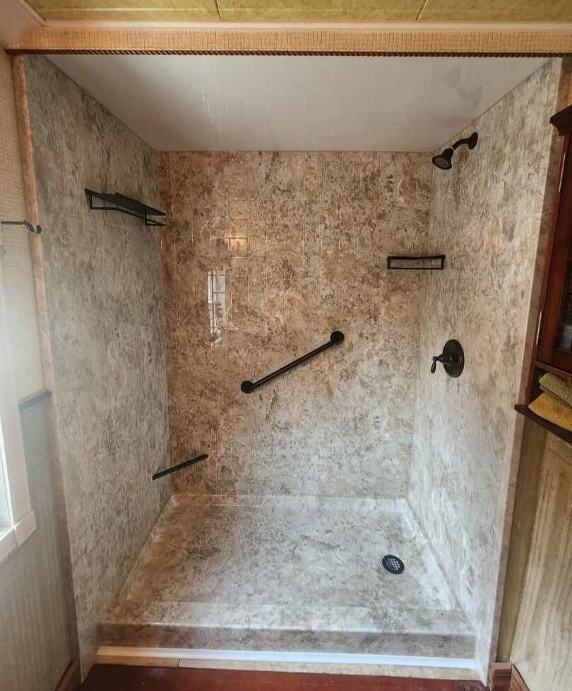 Completed shower renovation by New York Sash walk in shower with oil rubbed bronze fixtures