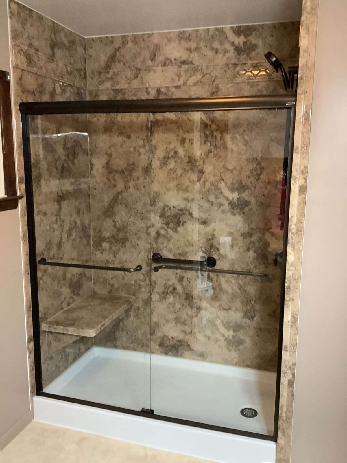 Completed walk-in shower Completed shower conversion with oil rubbed bronze fixtures